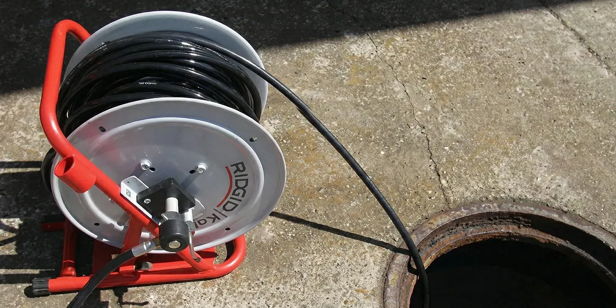 sewer rodding equipment prepared to clear clogged sewer lines in Indianapolis, IN