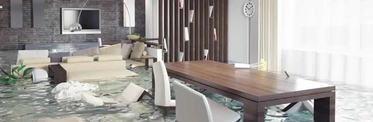 home interior affected by water damage with flooded floors and displaced furniture in Indianapolis, IN